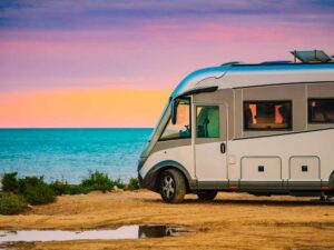 Larg RV parked at beach on sand