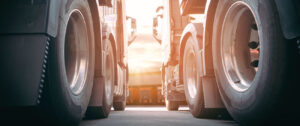 view from ground of two semi truck tires